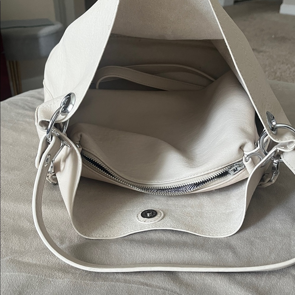 Madison West Purse in a purse
Cream purse w/ silver details. - Picture 3 of 6